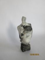 Figurative saggar fired form on pedastal 22cmH